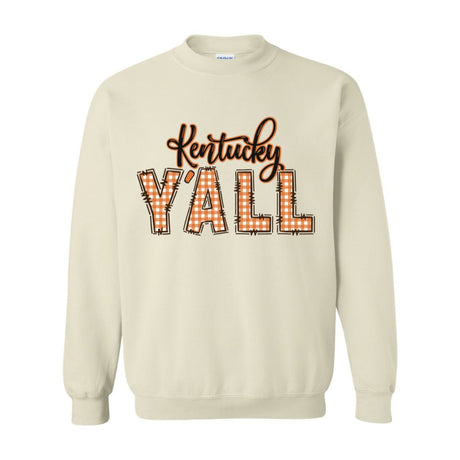 Off white crewneck sweatshirt with Kentucky written above a large all caps Y'all with a fall-themed orange plaid pattern